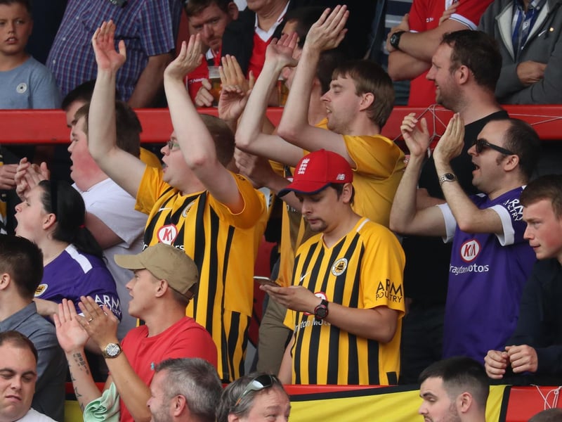 Phoning home from FC United of Manchester. Photo: Eric Brown
