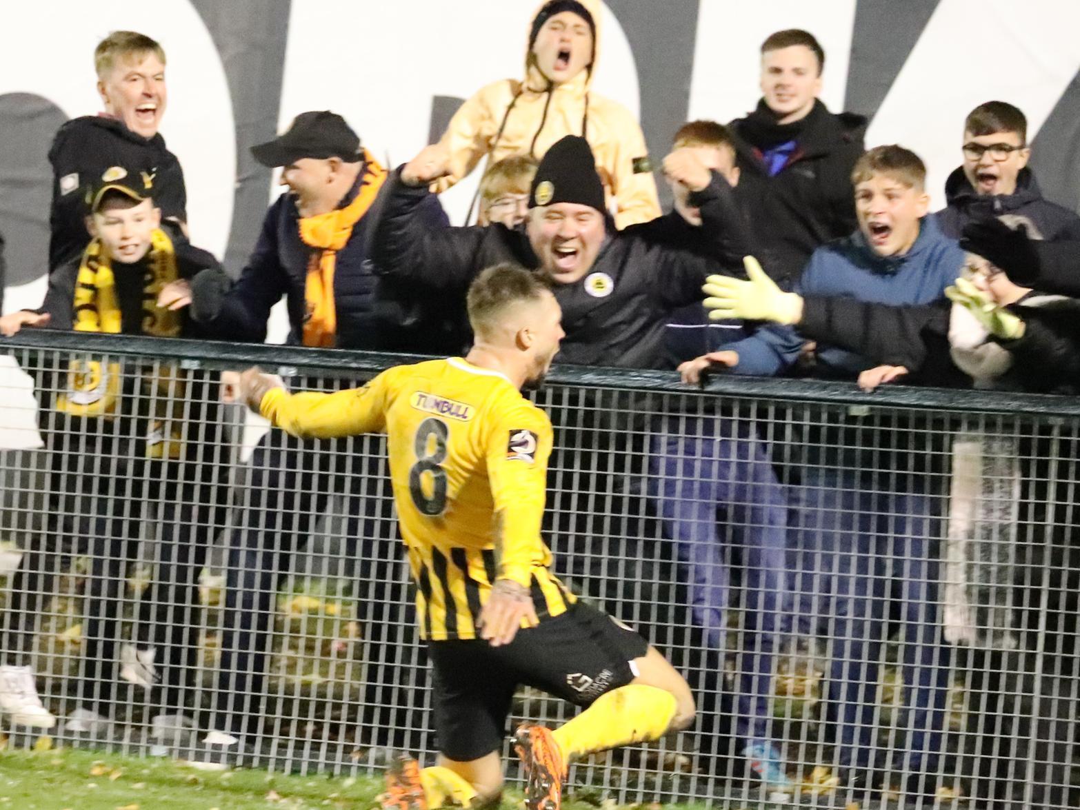 Brad Abbott celebrates a late goal at Farsley Celtic with fans. Photo: Eric Brown