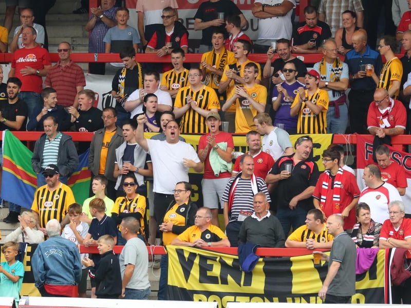 Sharing the stand with home fans at FC United. Photo: Eric Brown