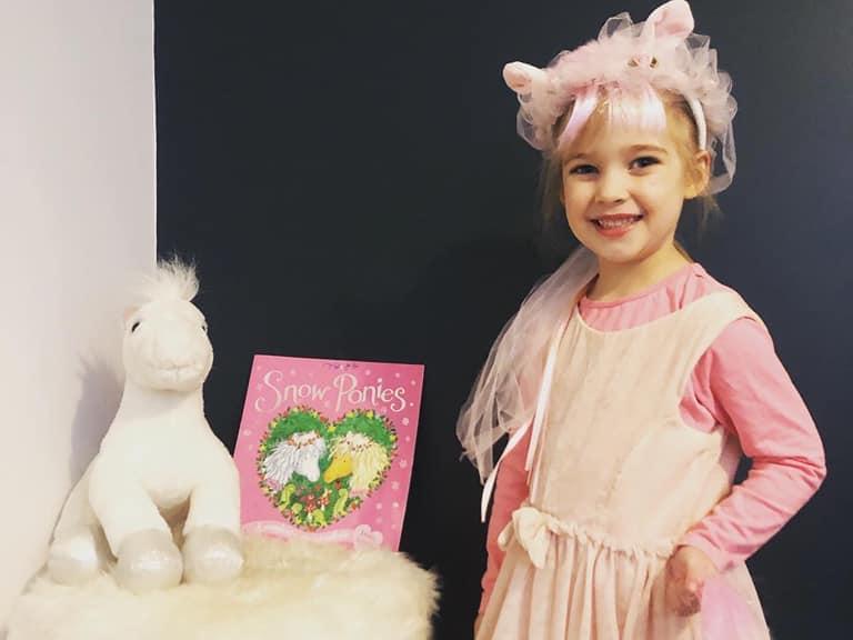 Neevie, aged 4, is dressed up as one of the ponies from her favourite book ‘Snow Ponies’.
