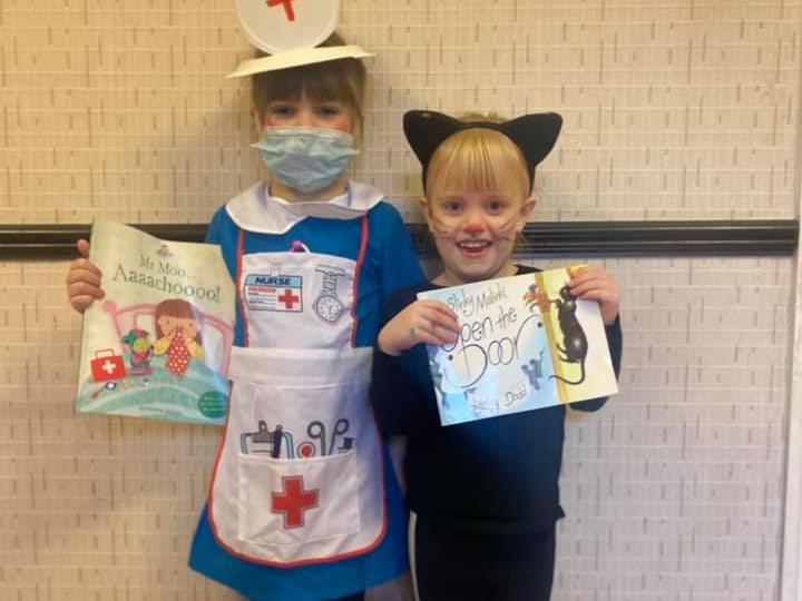 Sisters Sofia, 6, is dressed up as a character from Mr Moo Aaaachoooo and Brooke, 4, is a character from Slinky Malinki, Open the Door.