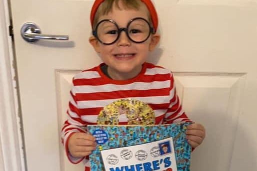 Little Tommy, 3, looks cute as a button dressed up as Where's Wally.