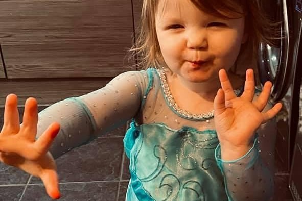 Willow, 2, is pretty as a princess today in her Disney Elsa dress.