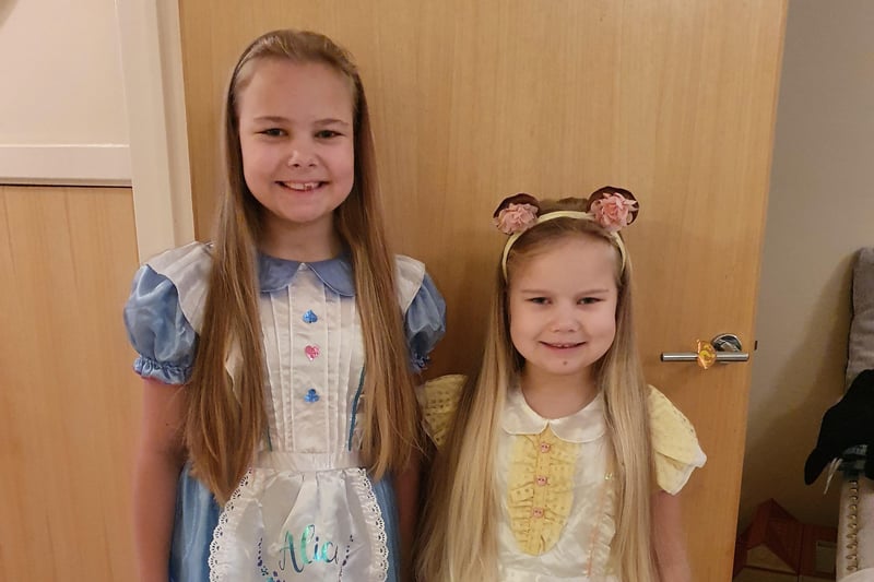 Sophie May Sutton, aged 10, as Alice and Jessica Sutton, aged 6, as Goldilocks SUS-210503-104919001