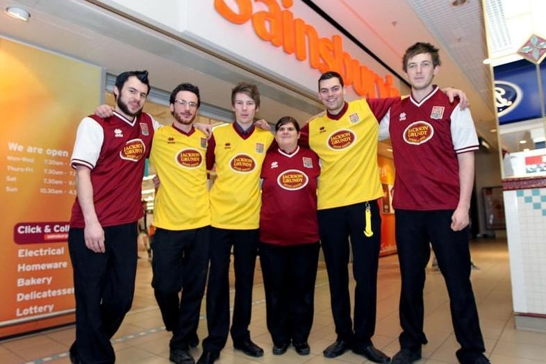 Kelvin Rudkin, Rob Walker, Dan Worthington, Hayley Barnard, Nathan Austin and Jono Abrams pictured showing their support to raising money for NGH, Macmillan and Cobblers' cancer appeal in 2012.