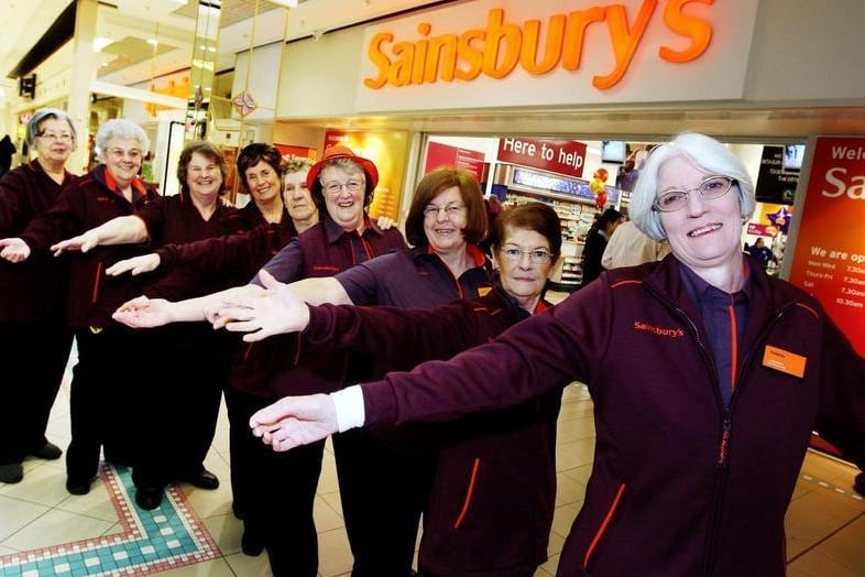Sainsbury's (Grosvenor centre) re-opens after a 12 day refit. Long serving staff members help with the opening of the store....Names & Service front-back: Valetta Maycock (40), Kay Isles (39), Janice Cave (38), Margaret Stonton (31), Mary Kiely (31), Chris Grant (30), Helen Ludlow (30), Heather Simmons (29), Linda Gibbons (28)