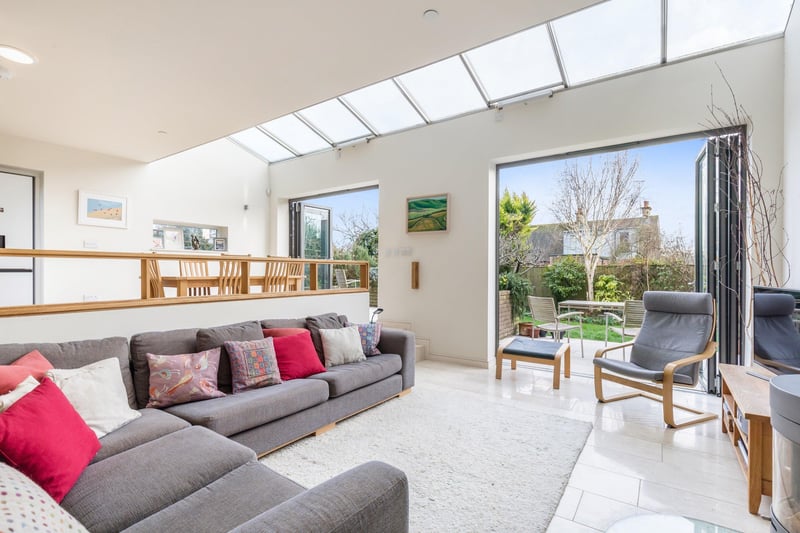 A split level open plan living space with bi-fold doors opening into a south facing rear garden.