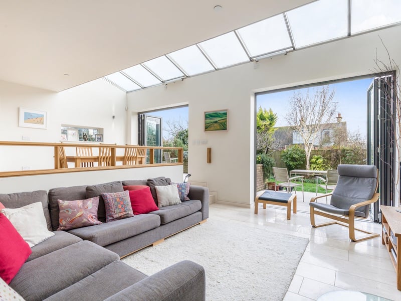 A split level open plan living space with bi-fold doors opening into a south facing rear garden.