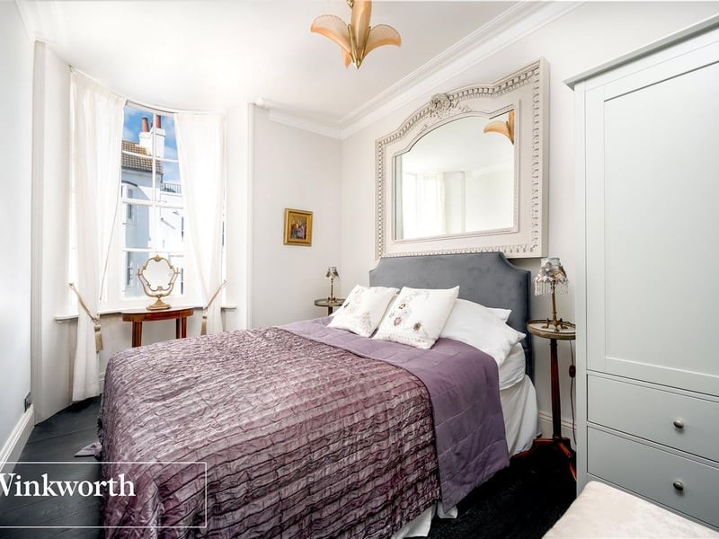 A welcoming and spacious tastefully decorated bedroom.