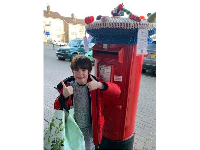 Seven-year-old Nathan helped Eloise Swain to install two of the toppers