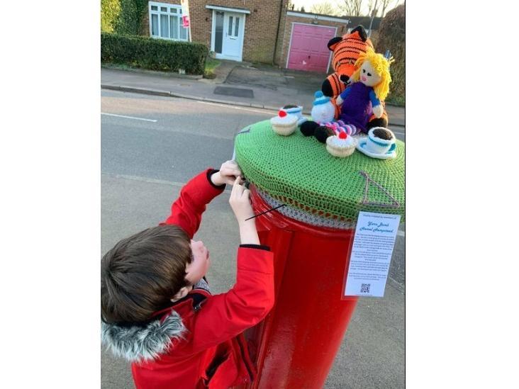Seven-year-old Nathan helped Eloise Swain to install two of the toppers