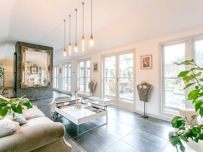A stunning, open plan room letting in plenty of light and featuring fired earth ceramic tiled floors.