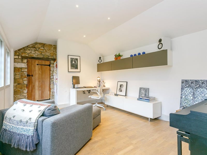 A great getaway is the office/snug, with exposed brickwork.