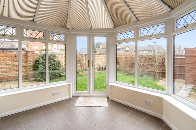 A spacious conservatory, perfect for relaxation, leads out on to a fully enclosed garden.