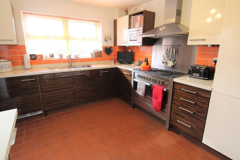 The kitchen/breakfast room features wall, base and drawer units and work surfaces over. Under cupboard lights. Integrated tumble dryer, washing machine and fridge/freezer.