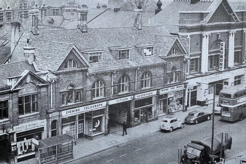 This  picture is not so much an aerial view as one taken from an elevated position. It shows the Broadway offices  (roughly opposite Tesco today) which were home to the Peterborough Telegraph from 1950 to 1971. The paper was then owned by EMAP – a company which at its peak employed more than 1,000 people in Peterborough alone. You can also see the old  Gaumont theatre in the picture.