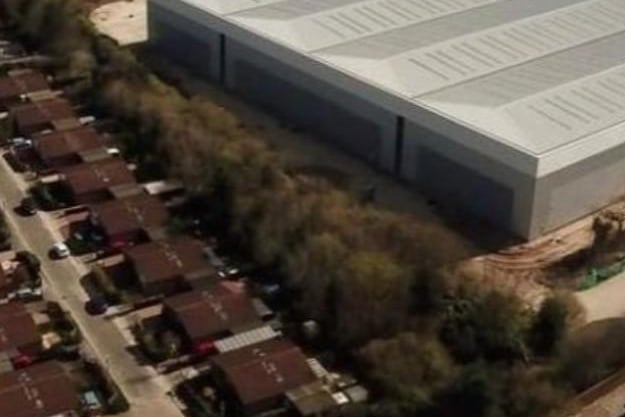 The massive warehouse overshadows residents' homes on Blakelands.