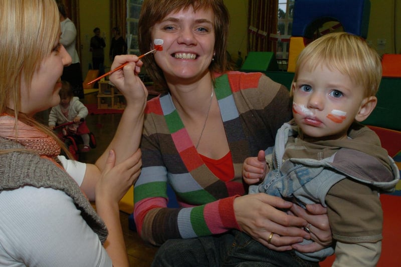 Wellingborough Croyland Nursery: Anna Grucela gets her face painted with son Olwier, 17 months.  November 2008
