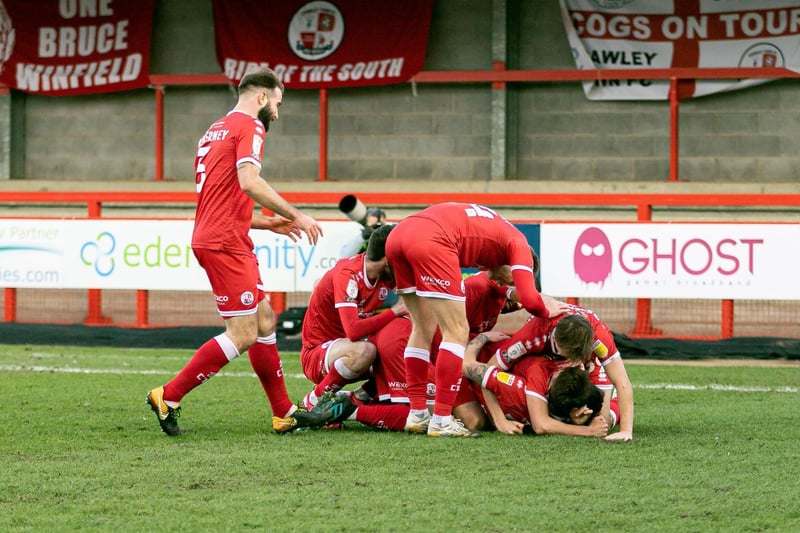James Tilley is on the bottom of the pile after scoring the winner