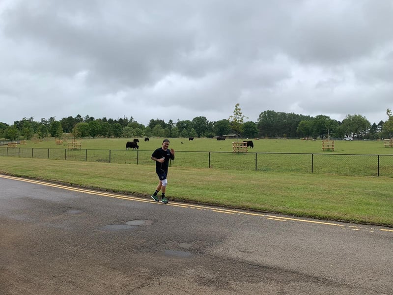 Bird keeper George Spooner runs a marathon around ZSL Whipsnade Zoo to raise money for the charity (C) ZSL