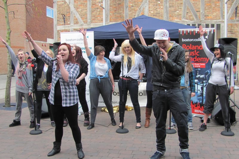 Boston College students performing the Glee version of Don't Stop Believing in the town's Pescod Square Shopping Centre.