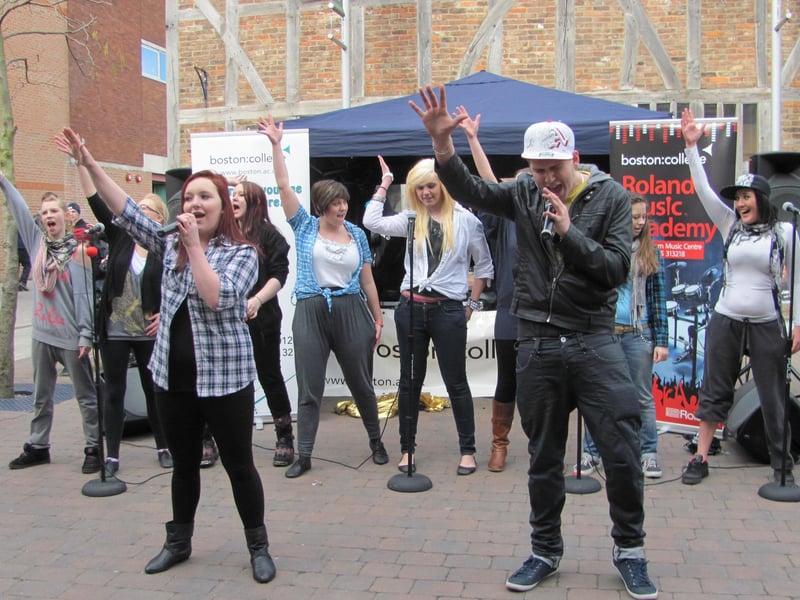 Boston College students performing the Glee version of Don't Stop Believing in the town's Pescod Square Shopping Centre.