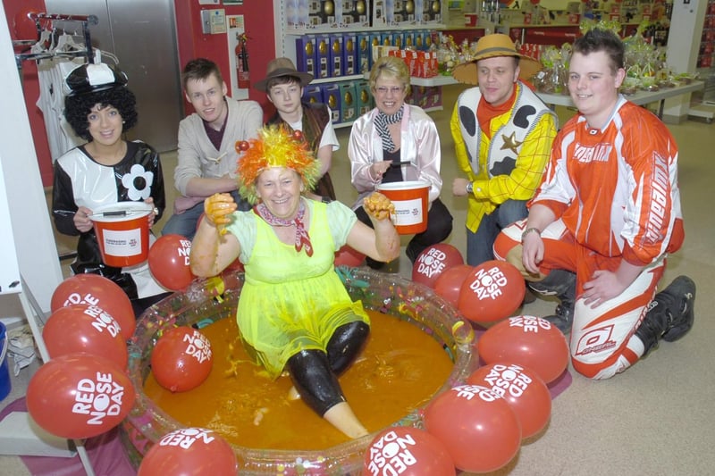 Fundraising at TK Maxx, Boston. Assistant manager Shirley Todd is pictured sitting in a bath of spaghetti, beans and tomatoes, with (from left) Ellie Marriott, Harry Jeffery, Mitchel Granger, Donna Hunt, Ian Sharman, and Jason Webster.