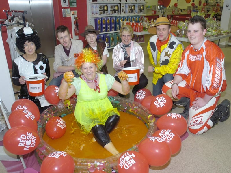 Fundraising at TK Maxx, Boston. Assistant manager Shirley Todd is pictured sitting in a bath of spaghetti, beans and tomatoes, with (from left) Ellie Marriott, Harry Jeffery, Mitchel Granger, Donna Hunt, Ian Sharman, and Jason Webster.