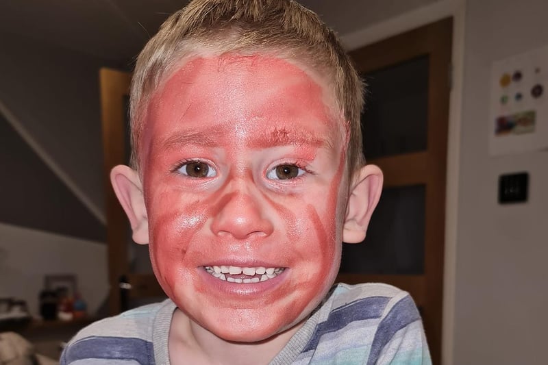 Unfortunately for Charlotte, her son got ahold of her lipstick! At least he's ready for Halloween - just a tad early.