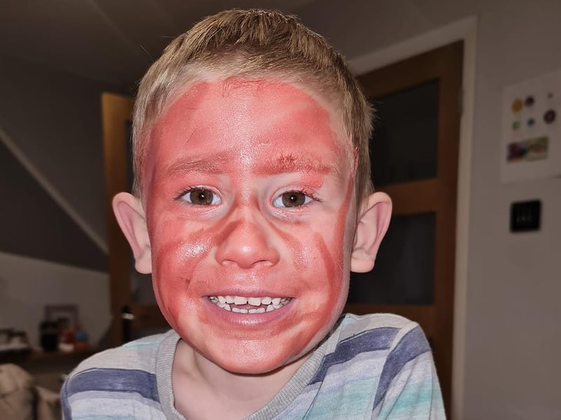 Unfortunately for Charlotte, her son got ahold of her lipstick! At least he's ready for Halloween - just a tad early.