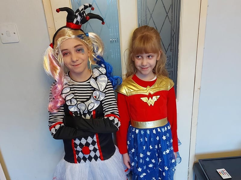 Zoe,10, dressed up as Harley Quinn and Rosie-May, 7, dressed as Wonder Woman.