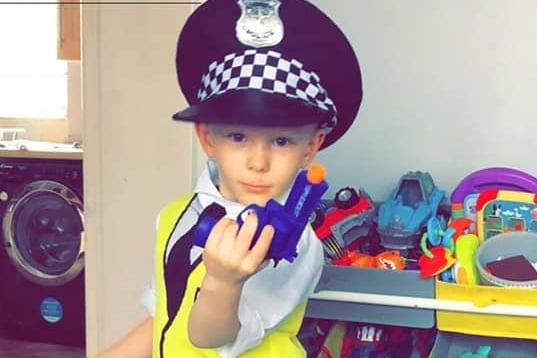You have the right to remain silent! Jacob, 5, dressed as a police officer.