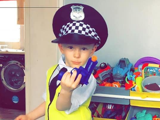 You have the right to remain silent! Jacob, 5, dressed as a police officer.