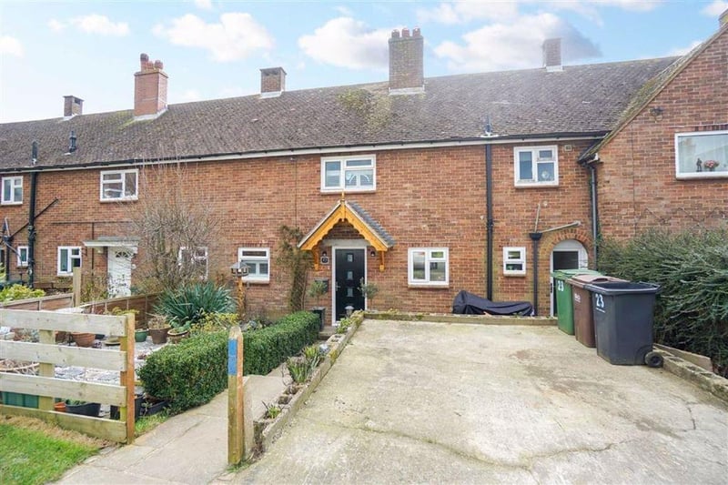 A three/four bedroom mid-terrace house with a large rear garden. Price: £299,950.