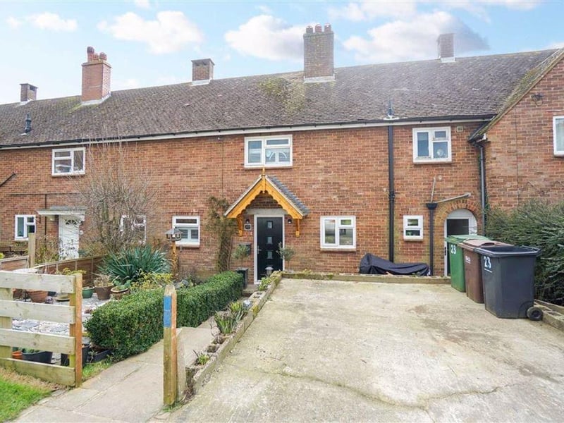 A three/four bedroom mid-terrace house with a large rear garden. Price: £299,950.