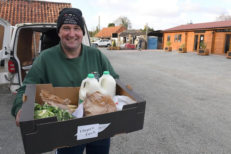 Sleaford streets and shops during Coronavirus Pandemic. Leasingham Manor Farm Shop & Garden Centre and The Ploughmans Barn, Danny Lidsey loading deliveries for those who are self isolating. EMN-210323-114022001