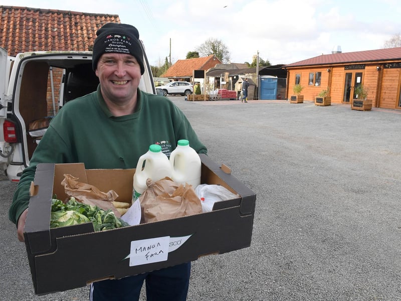 Sleaford streets and shops during Coronavirus Pandemic. Leasingham Manor Farm Shop & Garden Centre and The Ploughmans Barn, Danny Lidsey loading deliveries for those who are self isolating. EMN-210323-114022001
