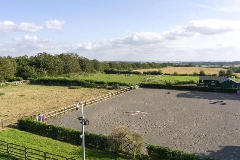 There is a substantial range of equestrian facilities including stabling with CCTV monitoring, floodlit mange and horse walker, adjacent to paddocks with automated watering troughs, extending to just over seven acres.