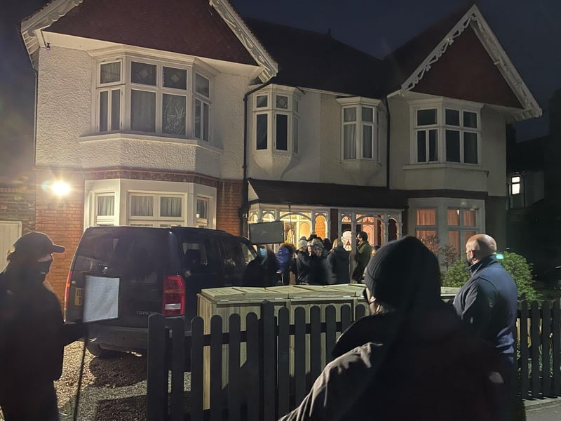 Presenter Fleur East and a TV crew surprise a family in Peterborough watched by some of the neighbours.