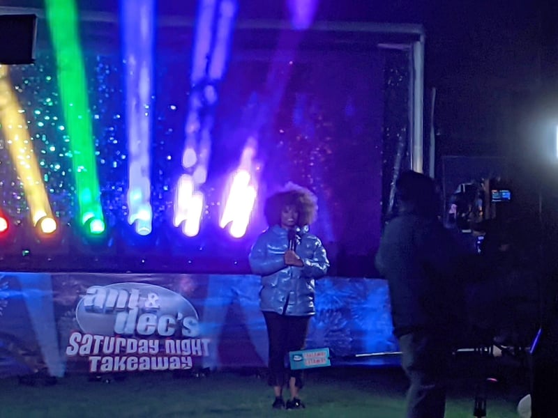 Presenter Fleur East broadcasting on the show live from Peterborough Cathedral.