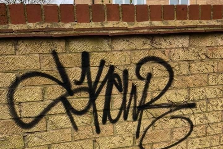 Graffiti spray painted onto a wall in Orton Brimbles.