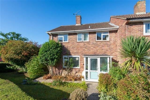 A spacious three bedroom end-of-terrace house on a corner plot. Price: £325,000.
