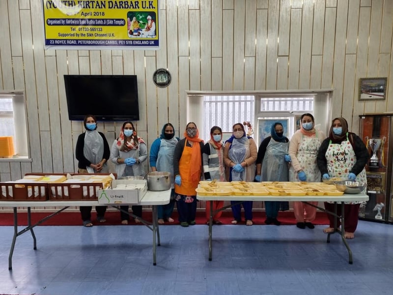 Sikhs prepare and deliver meals in Peterborough.