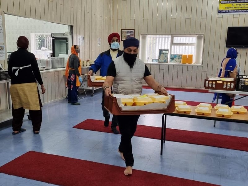 Sikhs prepare and deliver meals in Peterborough.
