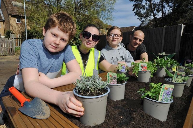 Residents Josh Hannon, Becky Graves, Chloe Hannon and Lloyd Moss get involved with the planting at Brudenell, Orton Goldhay.