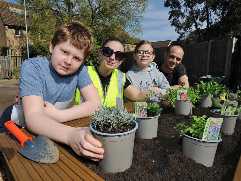 Residents Josh Hannon, Becky Graves, Chloe Hannon and Lloyd Moss get involved with the planting at Brudenell, Orton Goldhay.