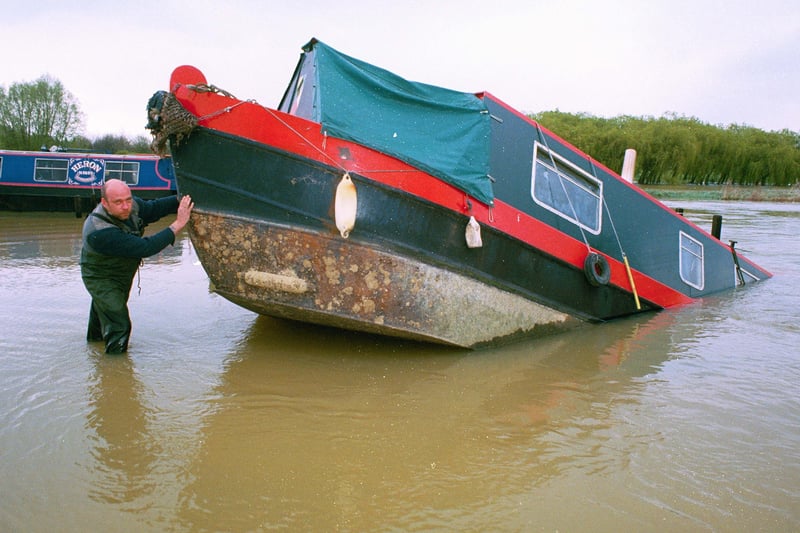 A narrow boat submerged by flood waters at Orton Mere in April 1998.