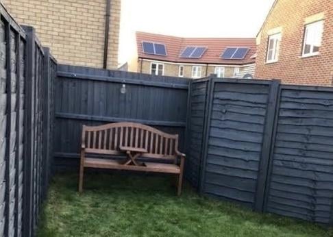 A seating area at the end of the garden before work started.