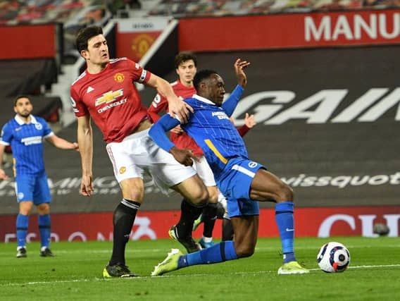 Man United defender Harry Maguire collides with Brighton striker Danny Welbeck