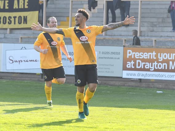 Celebrating a goal with Louis Briscoe.
